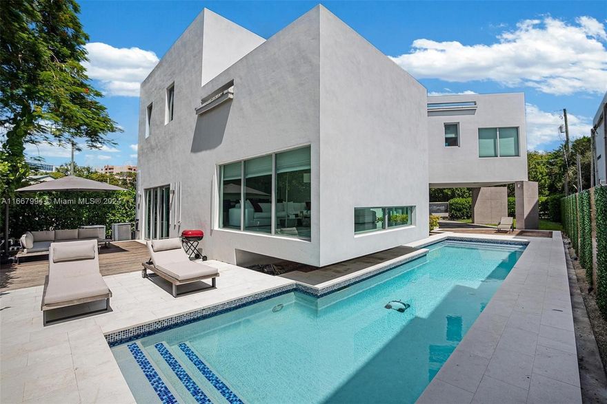 Discover this exquisite 2020-built single-family home in The Roads, offering a perfect blend of modern luxury and sustainability. This stunning property features 4 bedrooms and 3 baths, with 3 bedrooms and 2 baths located upstairs, and a versatile den with a full bath on the main level that can serve as a 4th bedroom or guest suite. The home boasts an open-concept layout with soaring double-height ceilings, allowing natural light to flood the space. The spacious backyard offers a beautiful pool and breathtaking panoramic views. The expansive master suite includes a jacuzzi and walk-in closets. Ideally located just few minutes from Brickell, Coconut Grove, and Key Biscayne, this home also features 37 solar panels for outstanding energy efficiency.