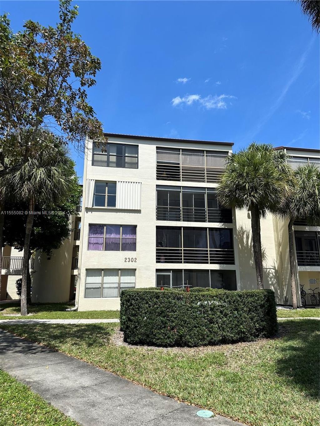 Photo of 2302 S Cypress Bend Dr #306, Pompano Beach, FL 33069 (MLS # A11555082)