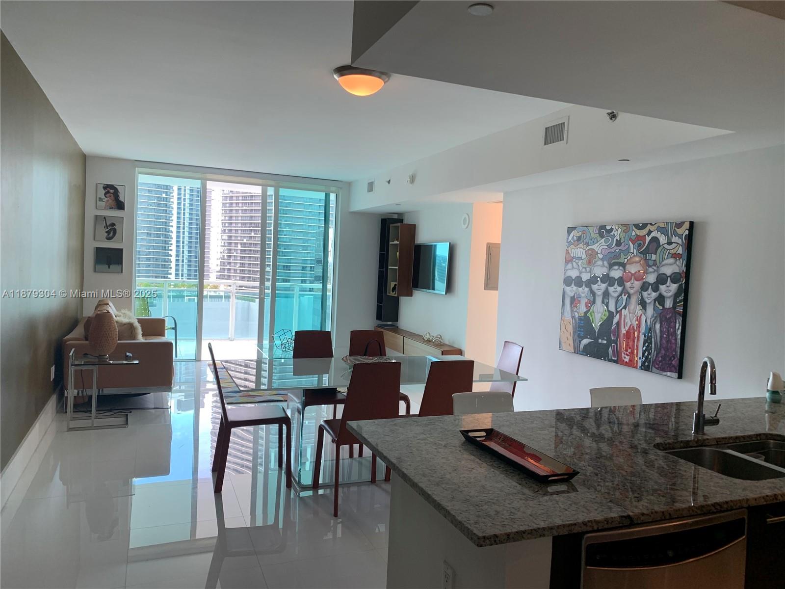 BEAUTIFUL CORNER UNIT WITH SPECTACULAR CITY AND WATER VIEWS, 24X24 WHITE GLASSES PORCELAIN FLOORS, ITALIAN KITCHEN, GRANITE COUNTER TOPS, AMAZING AMENITIES, POOL, SAUNA, FULL GYM, PARTY ROOM, POOL TABLE, THEATHER, BUSINESS CENTER, LOUNGE, AND MORE, WALKING DISTANCE TO THE BEST AREAS IN BRICKELL, COMPLETLEY FURNISHED AND A LOT OF DETAIL, AND NATURAL LIGHT, TWO CLOSETS IN THE MASTER BEDROOM,WONT LAST.....