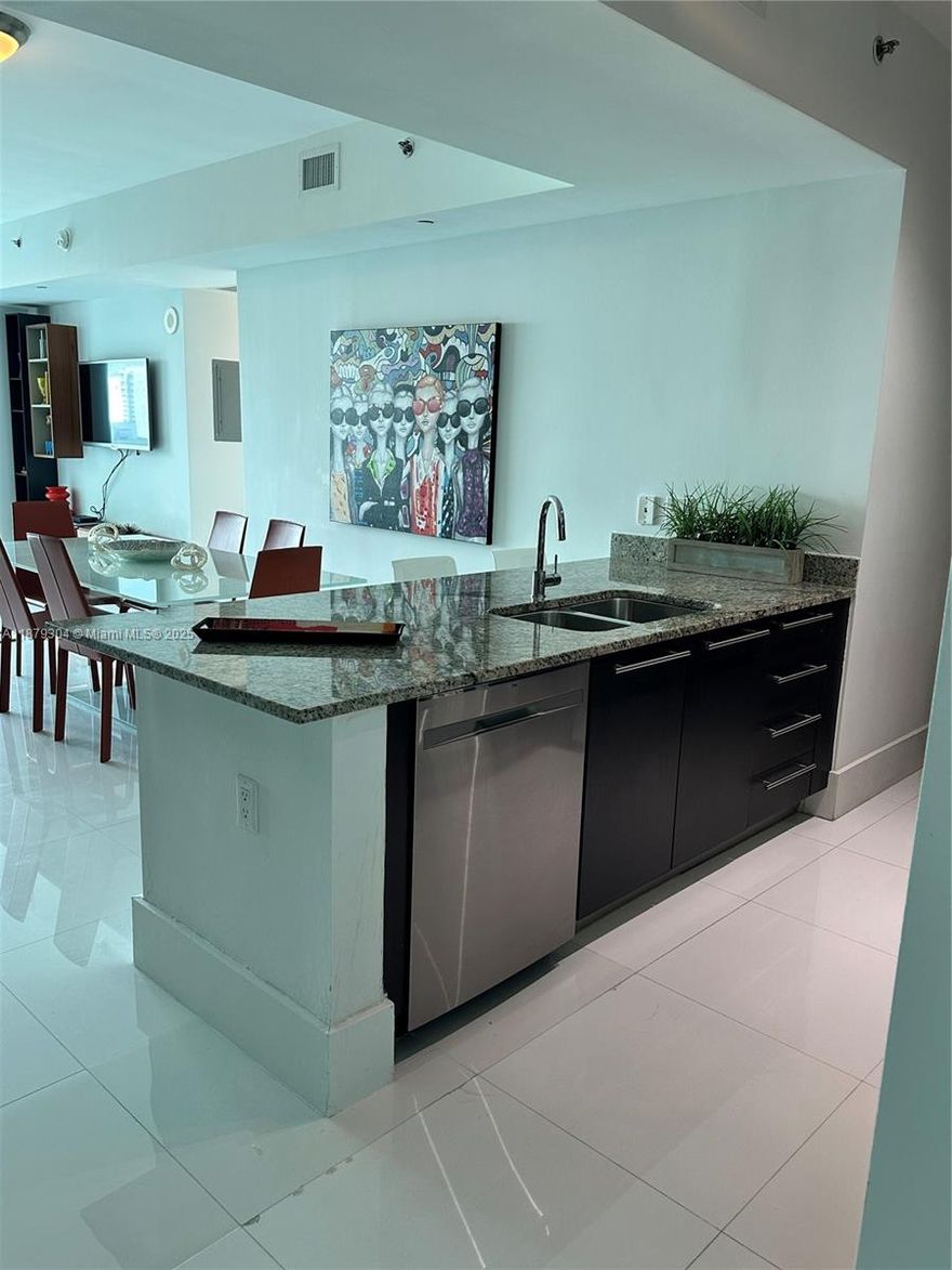 BEAUTIFUL CORNER UNIT WITH SPECTACULAR CITY AND WATER VIEWS, 24X24 WHITE GLASSES PORCELAIN FLOORS, ITALIAN KITCHEN, GRANITE COUNTER TOPS, AMAZING AMENITIES, POOL, SAUNA, FULL GYM, PARTY ROOM, POOL TABLE, THEATHER, BUSINESS CENTER, LOUNGE, AND MORE, WALKING DISTANCE TO THE BEST AREAS IN BRICKELL, COMPLETLEY FURNISHED AND A LOT OF DETAIL, AND NATURAL LIGHT, TWO CLOSETS IN THE MASTER BEDROOM,WONT LAST.....