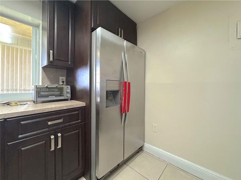 Photo of 9301 Lime Bay Blvd #105, Tamarac, FL 33321 (MLS # A11843394)