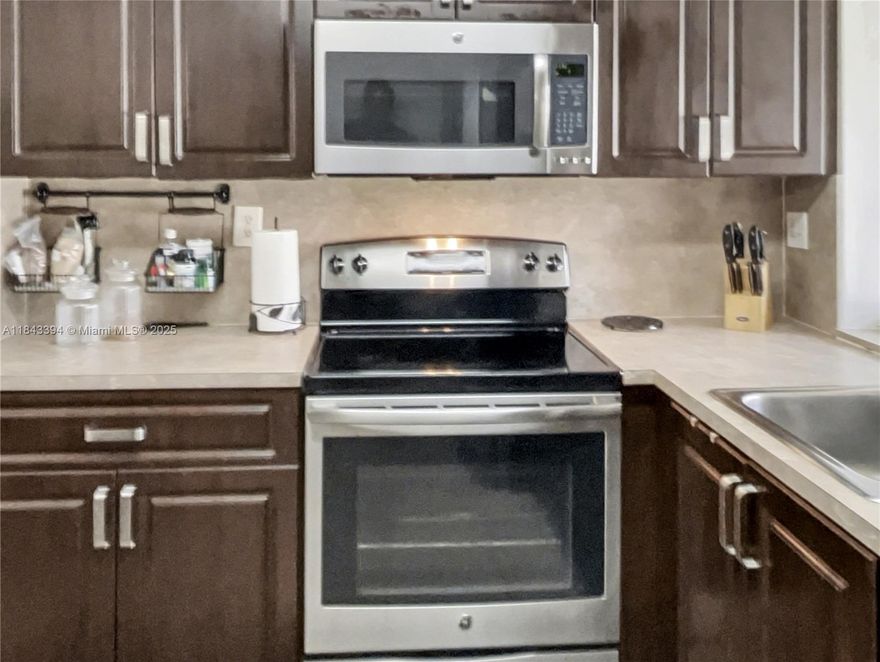 Priced to Sell at $105,000. Price Reflects Minor Improvements like paint etc. Beautifully maintained 2/2 in desirable Lime Bay Community. Located on the 1st floor with parking in front of the unit. The unit features a split floor plan; spacious kitchen with stainless steel appliances and comfortable social areas, an ample master bedroom with Walk-in closet and in-suit bathroom. New: AC, water heater, garbage disposal, sliding glass door, kitchen window.  Bathrooms previously updated with new toilets, master bathtub tiles and walk-in shower are in good condition. Amenities Clubhouse, pool, tennis/pickle ball, bingo, weekly barbecues & monthly social events.
Note: Photos have been virtually enhanced to show the space with a neutral wall color. The unit is currently painted yellow.