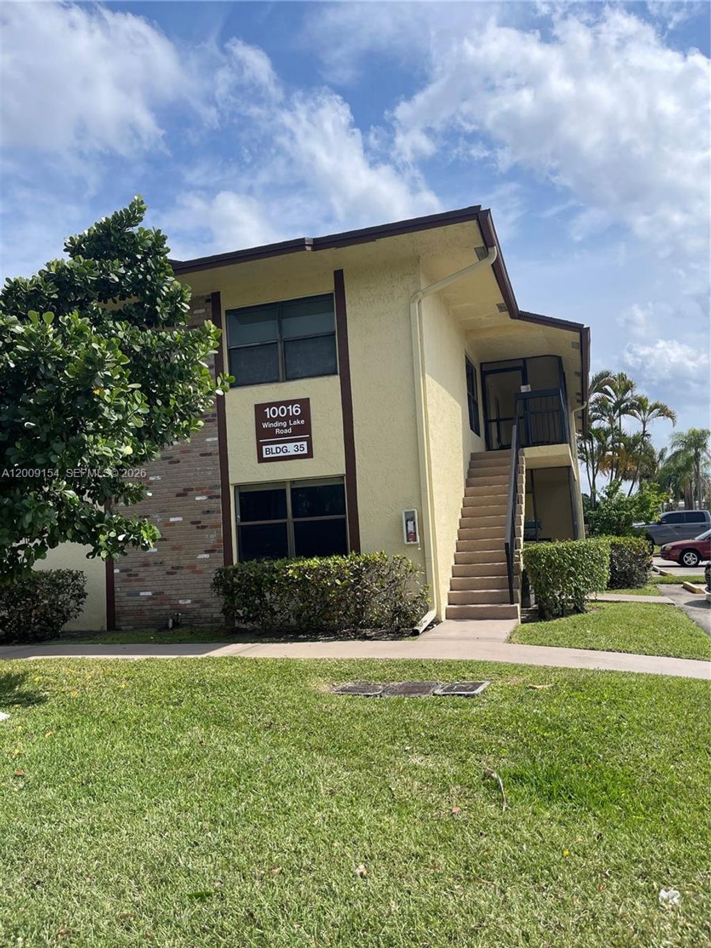 Photo of 10016 Winding Lake Rd #202, Sunrise, FL 33351 (MLS # A12009154)