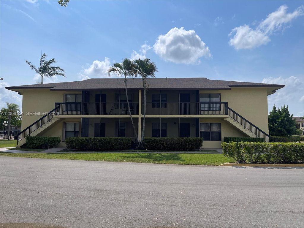 Photo of 10016 Winding Lake Rd #202, Sunrise, FL 33351 (MLS # A12009154)