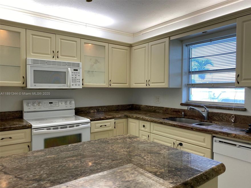 UPGRADED 2-BEDROOM 2-BATH CONDO IN GREAT CONDITION WITH ADDITIONAL SPACE PERFECT FOR HOME OFFICE OR DEN. BEDROOMS ARE OVERSIZED AND HAVE CUSTOM CLOSETS. THE OPEN AND SPACIOUS KITCHEN FEATURES CUSTOM CABINETRY AND GRANITE COUNTERTOPS. THIS CONDO IS MINUTES FROM SHOPPING, DINING, ENTERTAINMENT, AND THE BEACH. EASY ACCESS TO MAJOR ROADS (US1 & I95), AIRPORTS, CASINOS, ETC. BUILDING FEATURES COMMUNITY SWIMMING POOL, PICNIC AREA, LAUNDRY FACILITIES, AND SECURITY CAMERAS. ASSOCIATION ALLOWS PARKING UP TO 2 CARS PER UNIT (ONE ASSIGNED AND 2ND IN VISITORS SPOTS ON A FIRST-COME-FIRST-SERVE BASIS).