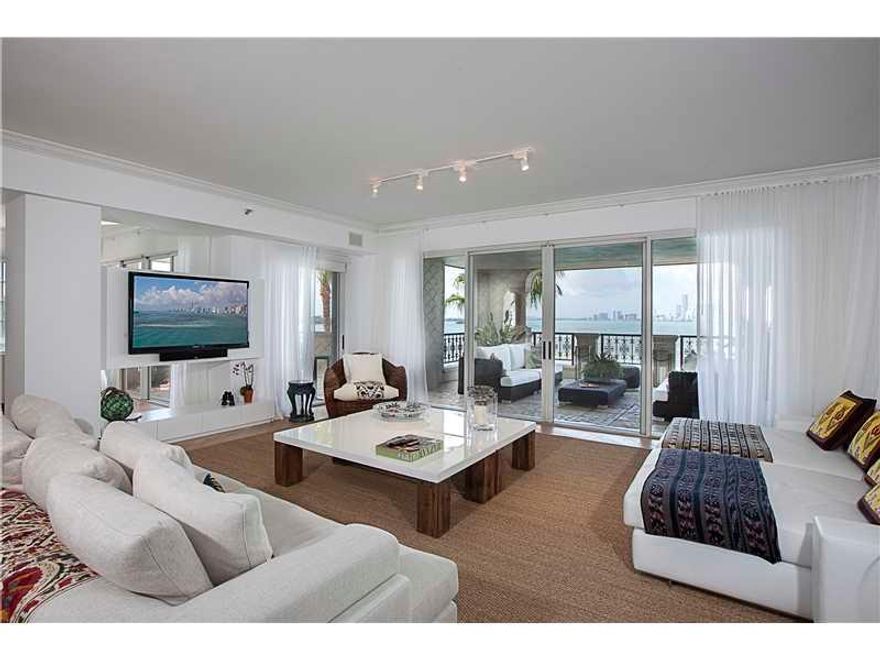 This spacious Bayview condo is an inspiration of layout and design. With over 4,000 SF of interior living, this spectacular residence is ideal for entertaining with four large bedrooms, four full and one half baths, an open terrace, formal living and dini ng rooms, and unobstructed wide bay, downtown, government cut and golf course views.  Adorned with hardwood floors, high ceilings, and exquisite finishes throughout, this exceptional condominium residence is as easily a family home as it is a showplace.