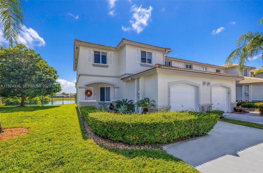 Contact Robin Perez for all inquiries 786 261 5393. Beautifully maintained 3-bedroom, 2.5-bath corner townhouse in the desirable Villas at Lago Mar! This rare corner unit offers extra privacy with only one neighbor, a dedicated home office, and stunning lake views with direct access—perfect for peaceful mornings or evenings.

The bright layout features ceramic tile downstairs and wood laminate upstairs—no carpet anywhere. The remodeled kitchen and downstairs bathroom (updated 3 years ago) include modern finishes and stainless steel appliances. Full impact windows throughout provide added safety, energy efficiency, and lower insurance costs.

The spacious primary suite features a renovated bathroom with dual vanities, a large shower, and ample closet space. Two additional bedrooms and a well-kept secondary bath complete the upstairs.

Enjoy outdoor living on your private fenced patio overlooking the lake. The community is quiet, well-kept, and offers a sparkling pool. Conveniently located near major expressways, shopping centers, restaurants, hospitals, and top-rated schools.

This move-in-ready corner home offers the perfect blend of privacy, comfort, and lifestyle. FHA and conventional offers welcome.