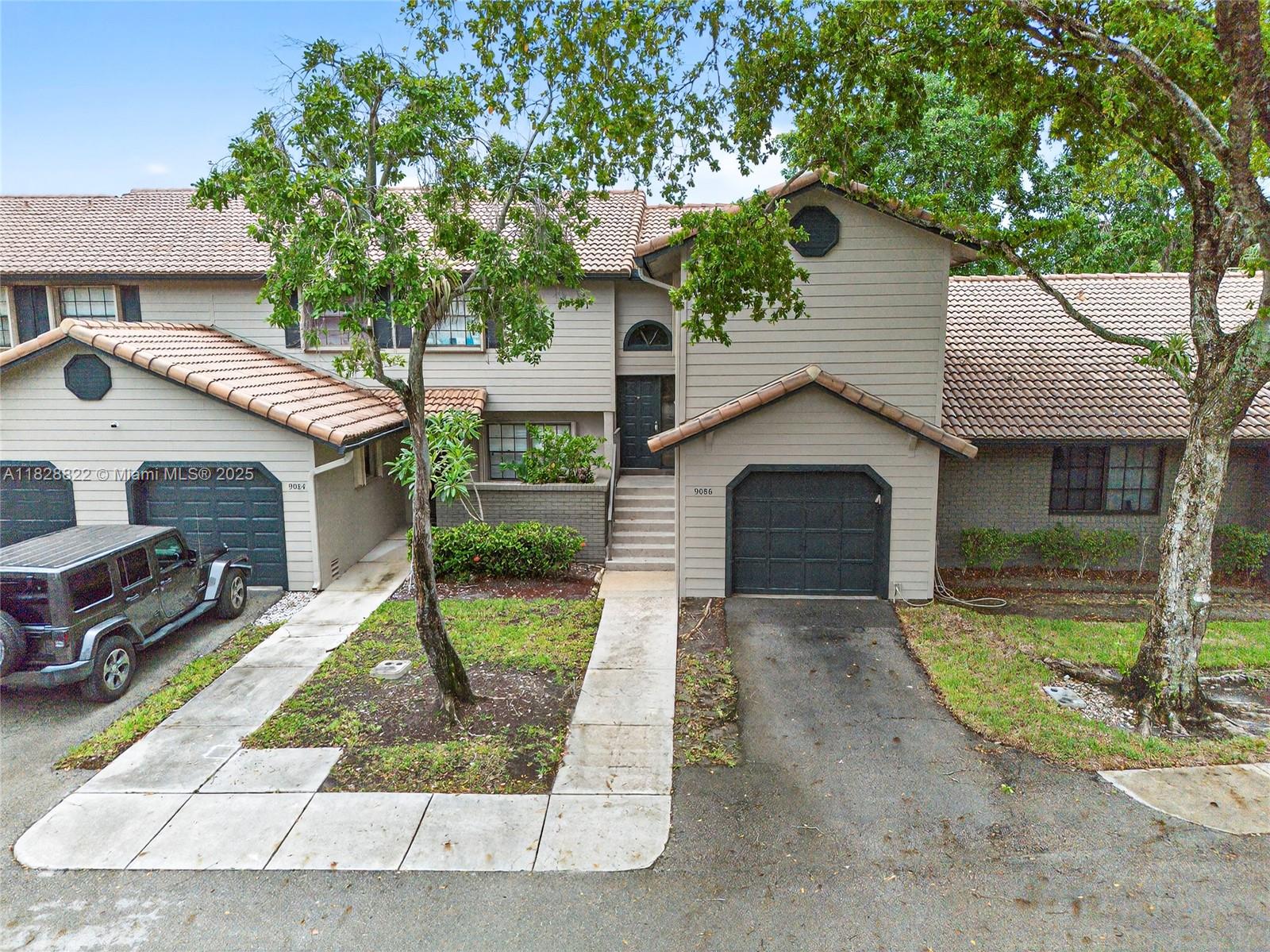 Welcome to this charming 2-bedroom, 2.5-bath townhome in the heart of Central Park, Plantation. The spacious living area features high ceilings and offers a beautiful view of the lake. Both upstairs bedrooms offer private bathrooms. Enjoy morning coffee or evening sunsets on your private patio overlooking the serene lake—one car garage. Governed as a condo, fees include insurance, roof repair/replacement, lawn care, landscaping, exterior painting, and exterior maintenance. Conveniently located near amenities and guest parking. Centrally located and minutes to highways, FLL airport, beach, schools, universities, parks/recreation, and shopping.