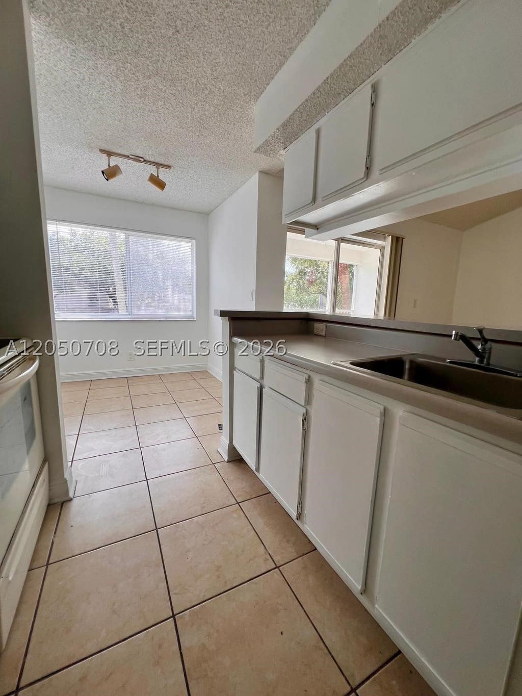 Photo of 5646 Rock Island Rd #205, Tamarac, FL 33319 (MLS # A12050708)