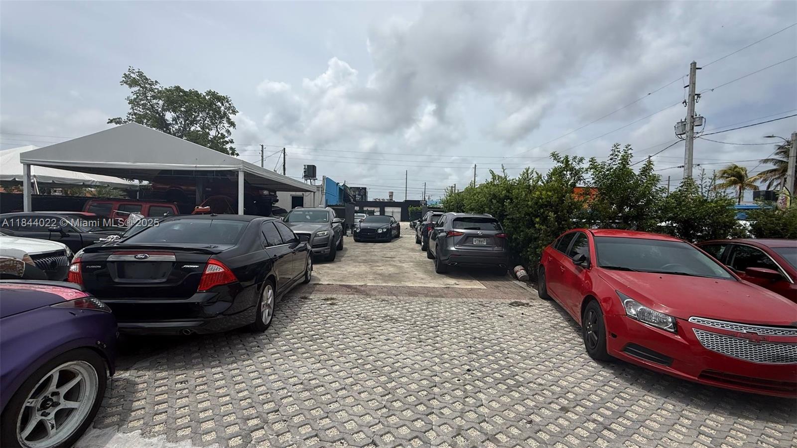 Prime industrial assemblage in the heart of Miami! This offering includes three contiguous lots totaling 9,245 SF (folios: 01-3113-024-1270, 01-3113-024-1010, 01-3113-024-1000), zoned 7000/Industrial - General. Currently operated as a car dealership with light mechanical use, the site can accommodate 30+ vehicles, features 2 private gated entrances, and includes a standalone building. Excellent visibility and accessibility, just west of Miami’s booming Little River neighborhood. Ideal for redevelopment, automotive, warehouse, or mixed industrial use. A rare opportunity in a rapidly growing corridor!