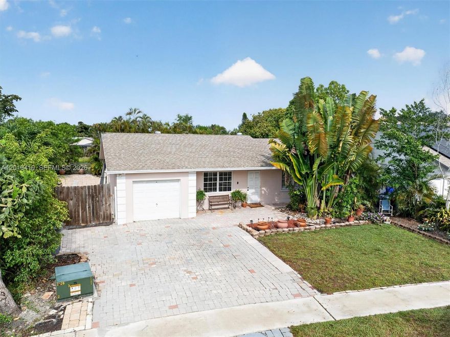 Bright canal-front home with endless potential in a sought-after community. This property features a spacious Florida room, converted garage for added living flexibility, and a pavered driveway with plenty of parking. Bring your boat or RV with convenient side access and enjoy a backyard with room for a future pool overlooking the canal. While the home is mostly in its original condition, it has been priced accordingly, offering an excellent opportunity for buyers to update and personalize to their taste. Residents enjoy access to community amenities including a pool, tennis courts, basketball courts, and playground. A great opportunity for buyers looking for space, lifestyle, and value.