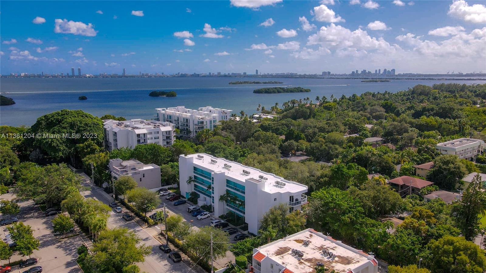 Contemporary & modern 2bed/2bath meticulously maintained Milana Unit located in the sought-after Upper Eastside/Morningside area just moments from the Bay, Morningside Park, local coffee shops & restaurants on Biscayne! A central location that will make all your friends envious! This 2007 construction modern building features secure lobby w/card entry, elevator & glass railings front & back. Unit features "wood look" tile floors throughout, sleek Venetian plaster treatment, kitchen with warm cabinetry, SS appliances & modern black granite, large picture windows & glass patio doors that let in tons of light & overlook the oversized balcony with tranquil views of mature trees & nature! Make this home your Shangri-La! NEW Washer/Dryer in-unit, 2-assigned space & guest parking. Pets ok!