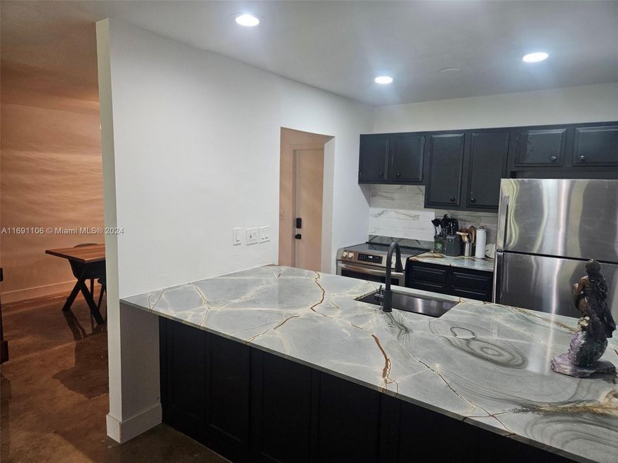 This spacious, open-concept home is move-in ready and located in the heart of East Boca Raton. Just minutes from the beach, shopping, Mizner Park, Boca Mall, and FAU, this property offers the perfect blend of convenience and tranquility. Situated in a quiet community with a LOW HOA fee of only $351 per month, it’s affordable and hassle-free. The complex is pet-friendly, allowing up to two pets per unit, and offers additional amenities like bike storage and a heated pool. Plus, the unit has a bonus washer and dryer combo in your unit for added convenience. Enjoy the outdoors with a charming covered patio overlooking the peaceful pool area. With its prime location, attractive price, and low maintenance costs, this is a wonderful opportunity to make this home yours!