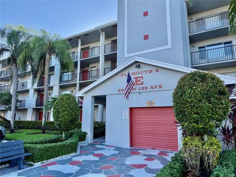 Photo of 801 SW 138th Ave #410E, Pembroke Pines, FL 33027 (MLS # A11862153)