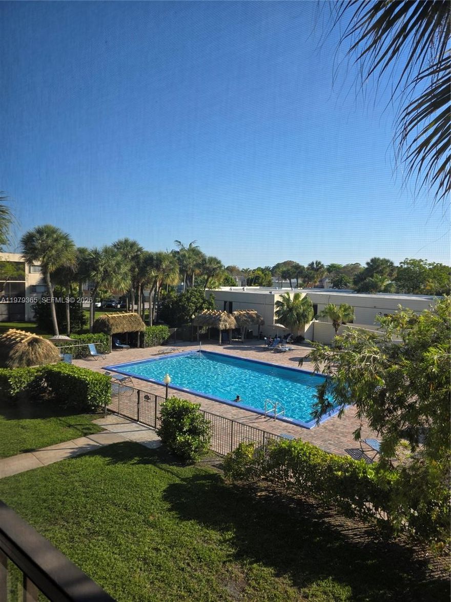 Welcome to this rare top-floor corner unit in Horizons East Condominium featuring one of the BEST views in the community overlooking the main pool and clubhouse. With only one neighboring unit and extra windows, this home is exceptionally bright and private. The living room and primary bedroom feature sliding glass doors leading to a screened balcony with beautiful views and a convenient storage room. Interior highlights include tile flooring throughout, fresh paint, remodeled bathrooms, and a spacious eat-in kitchen with stainless steel appliances. Major upgrades include central A/C replaced in 2021 and updated water heater, plus hurricane accordion shutters for added protection. Move-in ready and filled with natural light, this condo offers comfort, privacy, and resort-style living in a gated Kendall community with great amenities like: (3) pools, (4) tennis courts, 24 hour guard at gate plus a roving guard, remodeled beautiful clubhouse including gym, Lots of Guest Parking, beautiful park across the street from community INDIAN HAMMOCKS PARK, close to expressways, Miami Dade Community College  and FIU University, publix, shops, and much more.