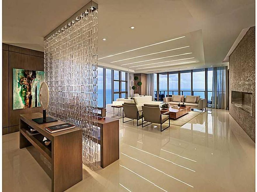 PREMIUM (01) LINE ON THE HIGH FLOOR WITH UNOBSTRUCTED PANORAMIC VIEWS OF DIRECT OCEAN, CITY AND BAY FROM THE 24th FLOOR. COMPLETELY REDESIGNED FLOOR PLAN,  WITH REPOSITIONED KITCHEN, 3 BEDROOMS AND ADDED DEN, THAT CAN BE CONVERTED TO 4TH BEDROOM TO ACCOMM ODATE LARGE FAMILY. CLEAN MODERN DESIGN FOR SOPHISTICATED CLIENT WITH MANY ADDED EXTRAS: NEST SMART AC SYSTEM, AUTOMATIC BLINDS IN ALL ROOMS, FIREPLACE IN THE LIVING ROOM AND CUSTOM MASTER BATHROOM - JUST TO NAME A FEW. CALL NOW FOR EASY SHOWINGS!