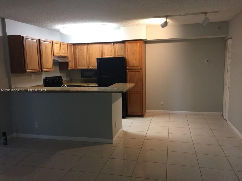 Photo of 841 Lyons Rd #24201, Coconut Creek, FL 33063 (MLS # A12019229)