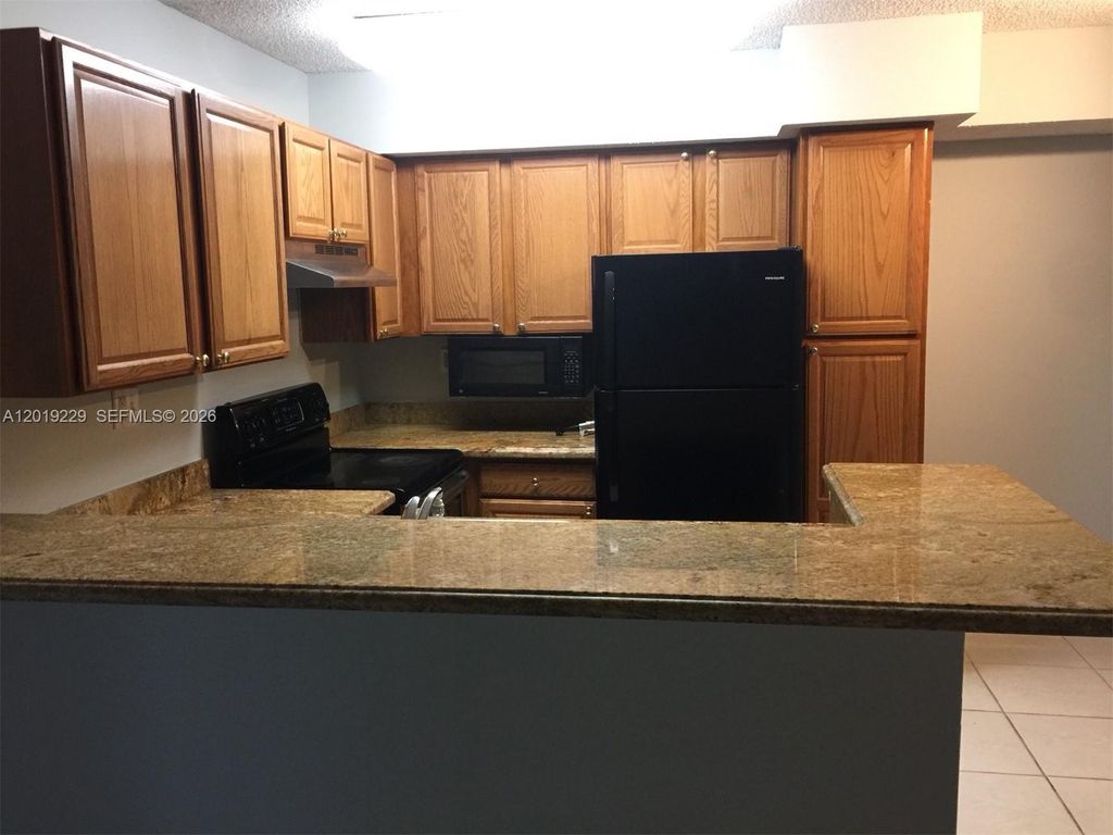 Photo of 841 Lyons Rd #24201, Coconut Creek, FL 33063 (MLS # A12019229)