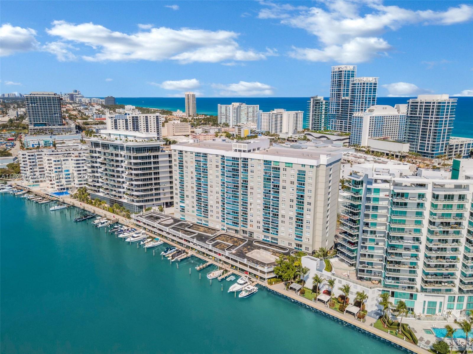 Assessment paid in full. HOA includes A/C, water, and cable. This oversized 1-bedroom, 1.5-bath condo offers stunning ocean and city views from a high floor in a full-service waterfront building. Features include impact windows and sliding glass doors, an updated kitchen and baths, spacious layout, and rare in-unit washer and dryer. Enjoy a private balcony perfect for ocean breezes and morning light. Building amenities include a bayfront pool, gym, sauna, valet, 24-hour security, and marina access. Located steps from the beach, Publix, restaurants, and Carillon Wellness Club. There’s a marina on-site, and dock spaces are occasionally available. Unit can be rented max 2 times per/year (minimum 6 months each)