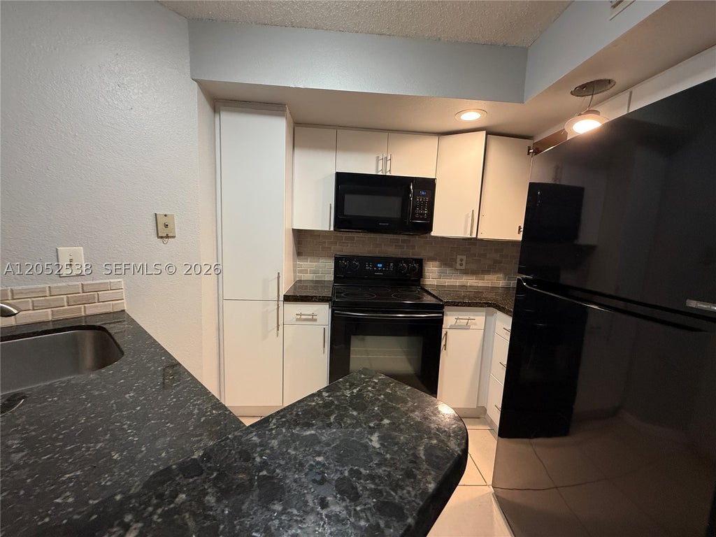 Photo of 663 Vista Isles Dr #1715, Sunrise, FL 33325 (MLS # A12052538)