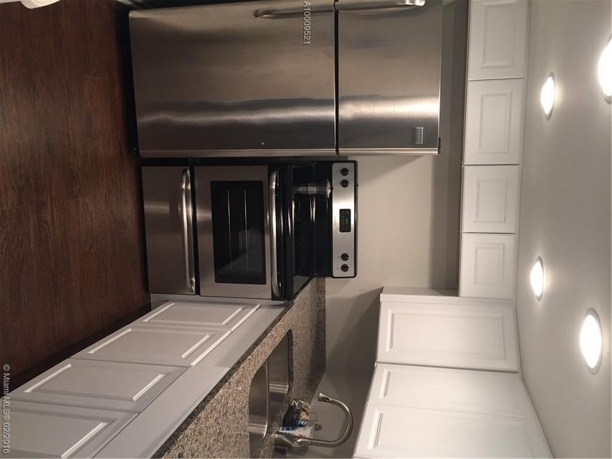 NEW GROUND FLOOR CONDO. LAKE VIEW. COMPLETELY REDONE! NEW KITCHEN, NEW STAINLESS-STEEL APPLIANCES, NEW GRANITE COUNTER TOPS. NEW BATHROOM WITH SHOWER, NEW WALLS AND FLOORS, NEW CEILINGS (ALL POP-CORN REMOVED), NEW WATER HEATER, NEW CLOSETS.  POOLS, CLUBHOUSE, SHOWS, PRIVATE BUS, WATER, CABLE, GATED WITH 24-HRS SECURITY ALL INCLUDED WITH ASSOCIATION. TWO ASSOCIATIONS MONTHLY FEES (AS OF 1/1/2016): $167.50 + $248.51 = $416.11. RENTALS ALLOWED AFTER CLOSING!". One Year Warranty on structure/appliances!