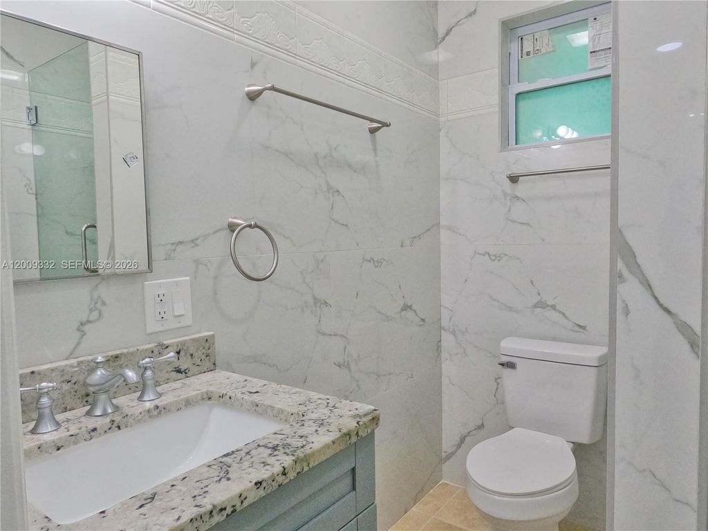 Photo of 1021 Mango Dr #B, West Palm Beach, FL 33415 (MLS # A12009332)