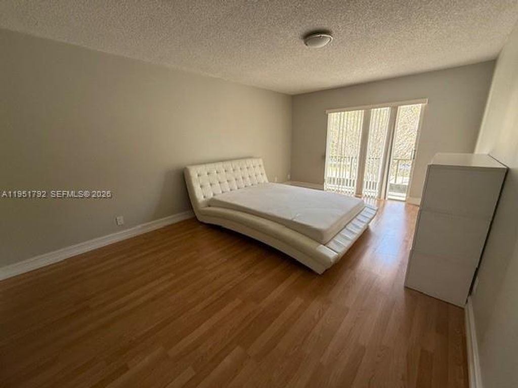 Photo of 4113 NW 88th Ave #203, Coral Springs, FL 33065 (MLS # A11951792)