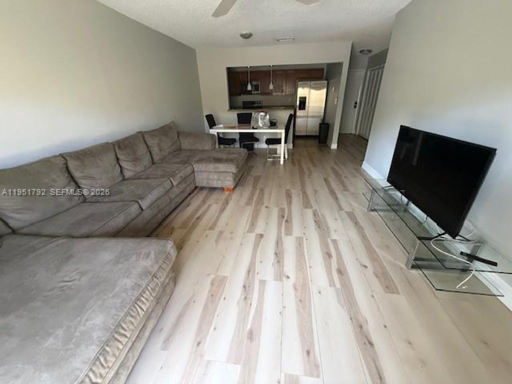 Photo of 4113 NW 88th Ave #203, Coral Springs, FL 33065 (MLS # A11951792)