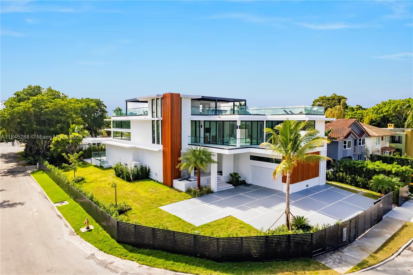 Welcome to this just-completed luxurious oasis in a prime waterfront location with a 100-foot dock at the tip of a channel open to Biscayne Bay. This exquisite property offers the epitome of modern living and convenience. The house features a modern and stylish architectural design and large windows for an abundance of natural light. The interior is elegantly designed, with an open floor plan creating a sense of fluidity and spaciousness. The crowning jewel of this residence is the rooftop, offering a 360-degree view of Miami's breathtaking surroundings. This rooftop has an outdoor fully equipped kitchen and ample space for dining and lounging. It's the perfect spot for taking Miami's skyline and enjoying beautiful sunsets, with friends and family.