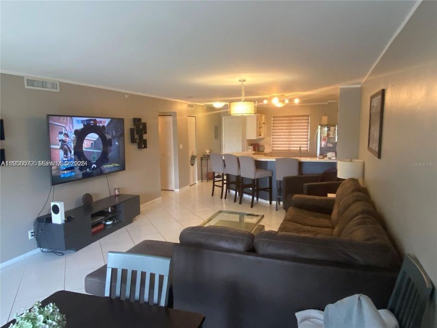 Great opportunity to own a fully furnished 2-bedroom, 2-bath condo with breathtaking views of the pool, lake, and garden.  Both bathrooms are tastefully updated, including a charming nautical guest bath and an elegant primary ensuite with a frameless shower and designer glass insets. The spacious primary suite features a large walk-in closet and an additional desk/office, or a sitting area, ideal for working from home or relaxing. Enjoy impact windows, a full-size washer and dryer, and a private screened balcony—ideal for morning coffee or evening drinks while watching wildlife on the lake. Resort-style amenities include a clubhouse, two heated pools, a gym, a sauna, pickleball and tennis courts, walking/jogging/biking trails, a poolside grill, a playground, and a wildlife preserve. Prime location—walk to The Pomp offering world-class entertainment, Harrah’s Casino, Topgolf, luxury hotel, dining, and boutique shopping.