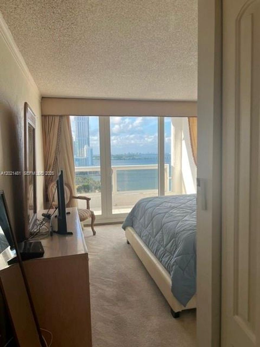 Experience stunning waterfront living from this beautifully appointed 2-bedroom, 2-bathroom condo on the 26th floor of The Grand. Enjoy breathtaking views of  the Miami skyline, Biscayne Bay, Margaret Pace Park and the ocean from your private balcony. This bright and open residence features sliding glass doors, a split-bedroom layout, a versatile den, and abundant natural light throughout.
Located in the heart of Edgewater, The Grand offers a prime location just minutes from Downtown Miami, Brickell, Wynwood, the Design District, Miami Beach, and Miami International Airport, making it ideal for both full-time living and investment opportunities. Short-term rentals are allowed.
Residents enjoy resort-style amenities including a pool, jacuzzi, fitness center, spa, 24/7 concierge, valet service, marina access, and retail shops conveniently located on the lobby level, featuring restaurants, a beauty salon, pharmacy, mini-market, and more.