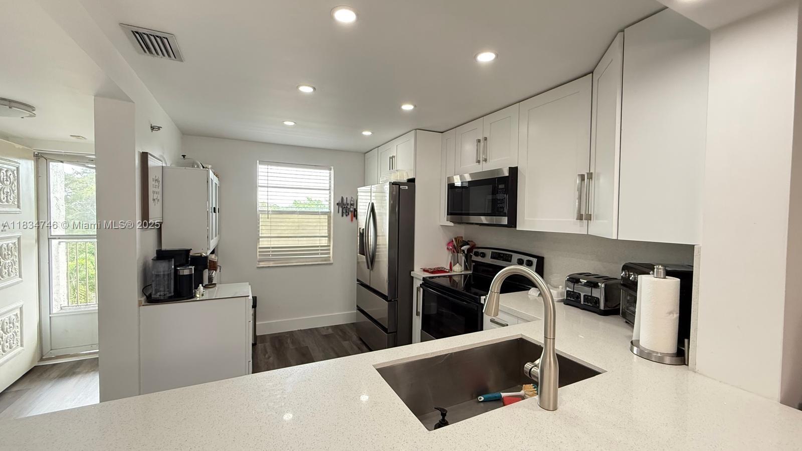 Upgraded Beautiful 2-bedroom, 2-baths Condo fully furnished in the centrally located community of 18th Hole of Inverrary with a large balcony and a garden view. looks like a model unit. It has white Shaker style cabinets, SS appliances, laminate wood floor, brand new AC, large Master Bedroom with Sitting Area and 2 closets, and much more. Complex has lots of amenities. Community is in close in proximity to shopping, dining, and I-75, Florida Turnpike and public transportation. Hurry this one won't last, easy to show!