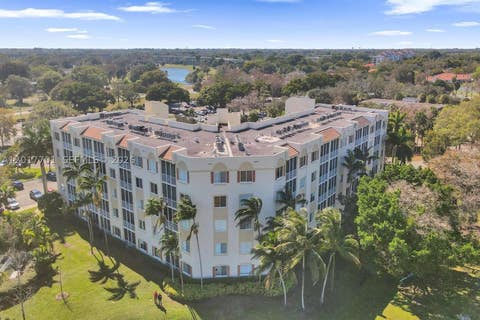Photo of 3600 Oaks Clubhouse Dr #511, Pompano Beach, FL 33069 (MLS # A12017701)
