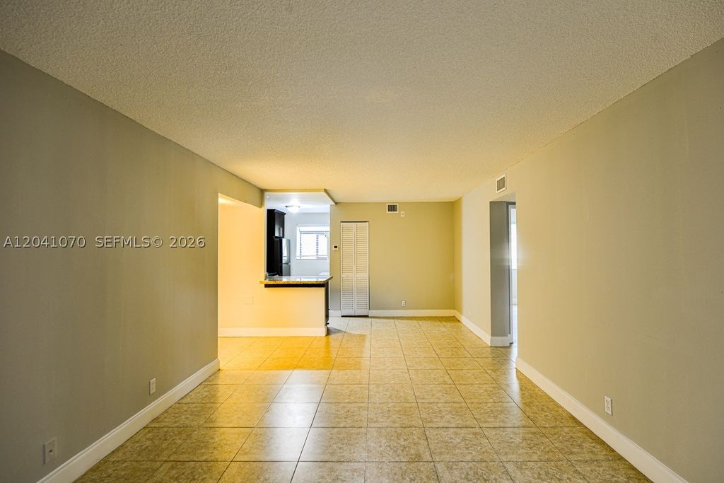 Photo of 703 Gardens Dr #102, Pompano Beach, FL 33069 (MLS # A12041070)