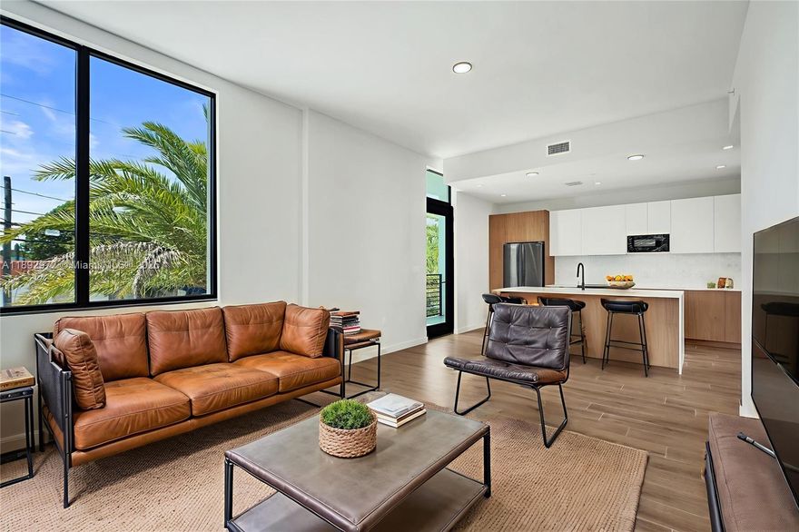 LAST CHANCE. Developer close-out at The Bennet! For the astute buyer, this brand-new, never-occupied, over 2,100 TSFT corner townhome is priced a staggering $150,000 under the recent appraised value. From the moment you pull into your private, oversized two-car garage, you'll know you've arrived. Inside, soaring 12-foot ceilings & expansive windows that fill the space with light. The meticulous, Italian-inspired luxury design boasts high-end porcelain tile, quartz counters & exquisite marble accents. A generous layout features 3 BR / 3 Bath, providing ample space for work & play! Enjoy the spectacular rooftop perfect for soaking up Miami's best sunrise / sunset views. Experience world-class amenities at your doorstep with incredibly low HOA fees. Secure this exceptional value today.