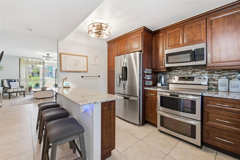 Photo of 10300 NW 30th Ct #109, Sunrise, FL 33322 (MLS # A11957999)