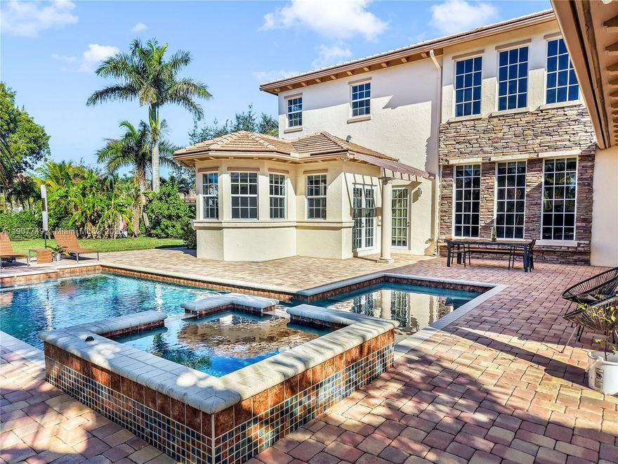 Luxury Smart Home in Parkland! This stunning 6-bed, 5.5-bath smart home in Parkland offers modern luxury with high-end upgrades. The fully remodeled second floor features new hardwood floors, a custom movie theater, a gym, and two renovated bathrooms. Oversized bedrooms, modern fans, and recessed lighting enhance the space, while natural sunlight fills every room. A grand office, oversized Primary suite with a walk-in closet, wet bar, and formal dining room complete the first floor. The resort-style backyard boasts a remodeled patio, basketball court, heated pool, mosquito system, and $250K in palm trees. A state-of-the-art Eufy security system ensures safety. Experience luxury living—schedule your showing today!