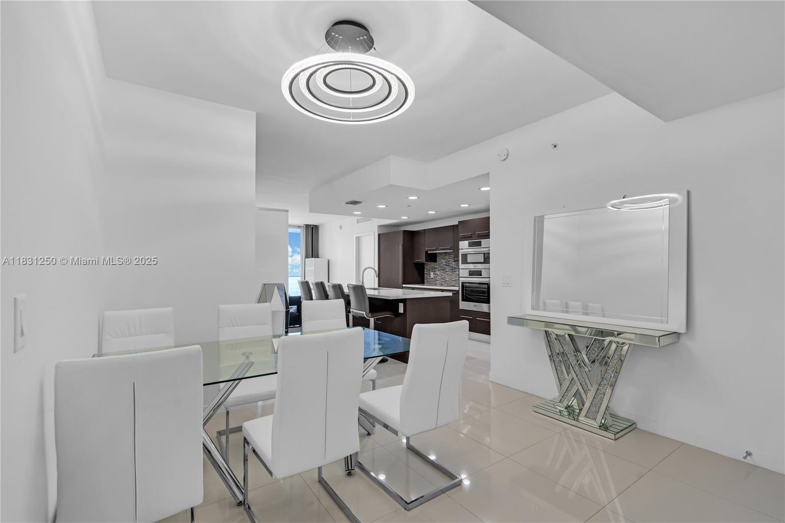 Modern luxury in Midtown Doral! Furnished 3BD/2.5BA corner unit with spacious balcony, perfect for relaxing or entertaining. Offered furnished or unfurnished. Includes 3 parking spots (3rd negotiable). Features porcelain tile floors, impact windows, in-unit washer/dryer, and high-speed internet. European kitchen with quartz countertops, Bosch appliances, and smart home features. Upscale building with modern lobby, lounges, and ballrooms. Prime location near Miami Intl Airport, major highways, Dolphin Mall, Publix, and more. Priced to sell!