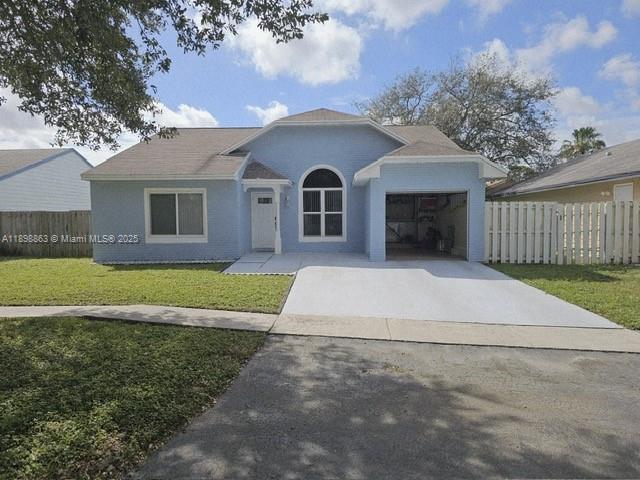 3-bed, 2-bath single-family home in the heart of Pembroke Pines! This inviting home features a bright open layout, High Ceilings and a peaceful backyard, tankless hot water heater, newer stainless steel appliances, and hurricane impact windows and doors throughout. The community offers low $125/month HOA, featuring ceramic tile and an upgraded kitchen with stainless steel appliances. Bathroom Marble Tiles on floor and Wall accent. Upgraded bathrooms.and well-maintained--move-in ready!