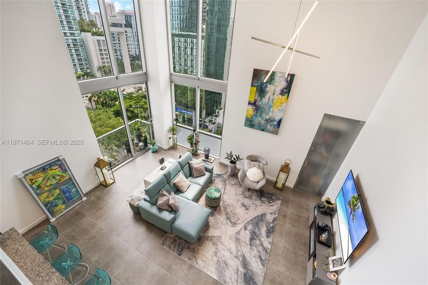 Welcome to the highest-floor loft corner residence at 1060 Brickell Avenue — a truly rare offering in the heart of Miami’s dynamic Brickell neighborhood. As the only loft currently available in the building and the highest floor for this coveted line, this 2-bedroom, 2-bathroom residence delivers unmatched elevation, privacy, and panoramic north- and east-facing skyline views.

Defined by its dramatic 20-foot floor-to-ceiling windows and soaring double-height ceilings, the home is flooded with natural light from sunrise to sunset. As a premier corner unit, it captures wide-open, unobstructed vistas of Brickell’s most iconic towers, offering breathtaking morning sunrises and dazzling city lights at night.

The open-concept layout is thoughtfully designed for both everyday comfort and stylish entertaining. A sleek Italian-style kitchen features modern cabinetry, stone countertops, and stainless steel appliances, seamlessly connecting to expansive living and dining areas. Step onto your private balcony and take in the vibrant energy of the city from above — a true urban retreat in the sky.

Perfectly positioned just steps from Mary Brickell Village and Brickell City Centre, you’ll enjoy immediate access to world-class dining, luxury shopping, cafés, and nightlife. The MetroMover, major highways, and the Miami River are all moments away, enhancing both convenience and connectivity.

All remaining assessments will be paid at closing.