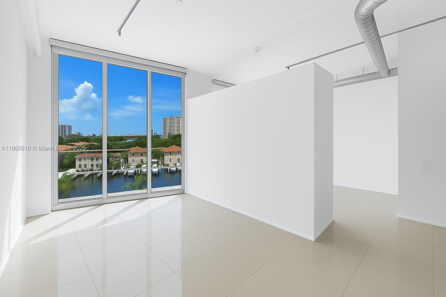 Modern Loft | 1 Bedroom + Den | 2 Full Baths
This stunning loft residence boasts soaring 11-ft floor-to-ceiling windows that flood the space with natural light, an open-concept design, in-unit washer & dryer, and a spacious private balcony showcasing beautiful open water and canal views.
Enjoy resort-style living with luxury amenities including a waterfront pool deck with spa, tennis courts, state-of-the-art fitness center, sauna, and more.
Ideally located within walking distance to Aventura Mall and just minutes from Sunny Isles, Bal Harbour, and Fort Lauderdale.
