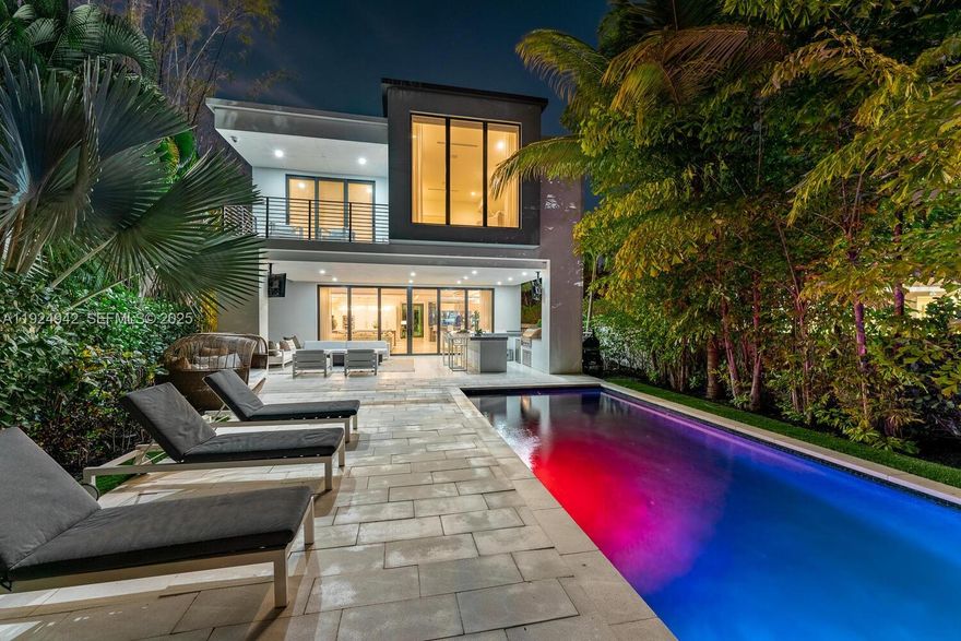 Positioned in one of the most glamorous and sought-after locations off Las Olas, this ultra-modern waterfront villa in Beverly Heights delivers unmatched style and opulence. Offering over 6,000 sq ft of custom luxury living, the home features a dramatic two-story glass entry, a climate-controlled wine cellar, elevator, and expansive indoor/outdoor entertainment spaces. The grand primary suite is complemented by unique aquarium installations, including a jellyfish and octopus display that elevate the home’s artistic flair. Outside, enjoy a true resort setting with an infinity pool, lush tropical Zen garden, outdoor firepit, gourmet summer kitchen, and covered wet bar. With a 36–40 ft deep-water dock, ocean access, and no fixed bridges, this is the ideal launch point for your Bahamian getaways. Steps from Las Olas’ premier dining and shopping, this residence embodies waterfront luxury at its finest.
