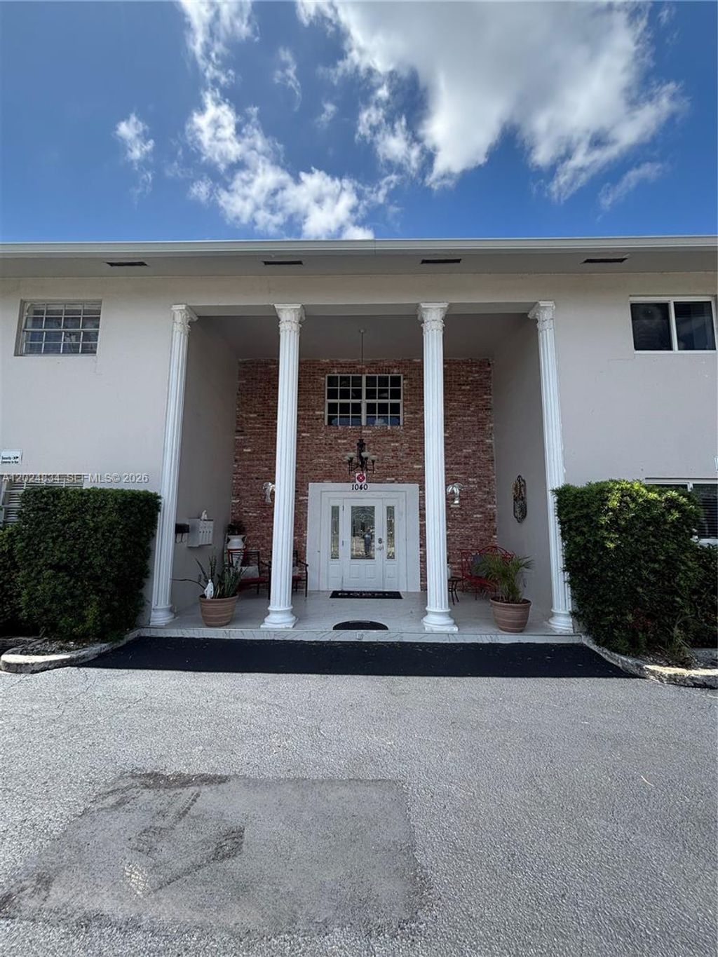 Photo of 1040 Crystal Lake Dr #2, Deerfield Beach, FL 33064 (MLS # A12024834)