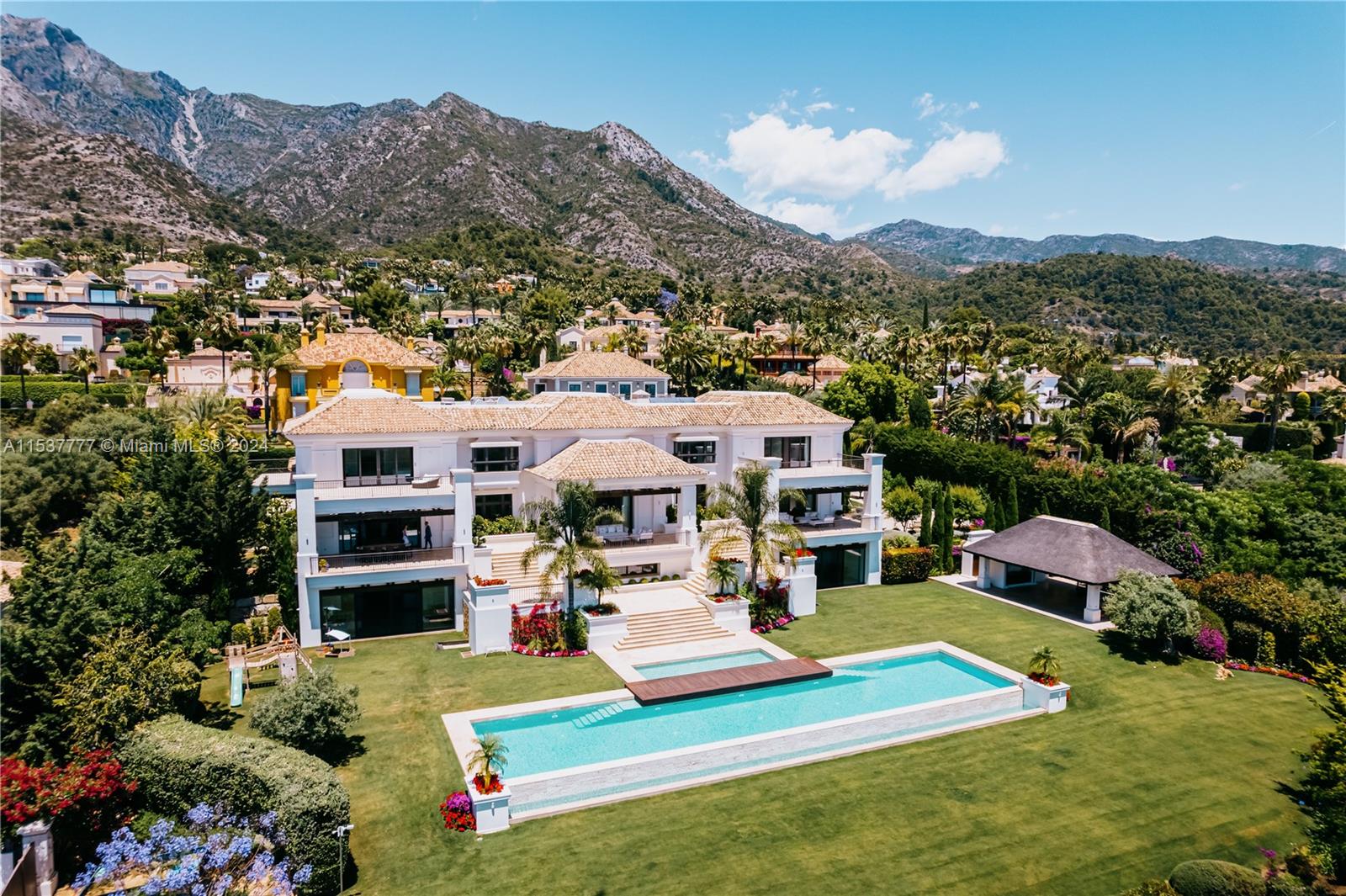 Property is located in Marbella, Spain. Nestled in Marbella's Golden Mile, 'WONDERFUL' is a newly built private estate boasting panoramic views. With elegant Mediterranean style, it offers luxurious design and modern amenities. The grand mansion features a stunning entrance hall, spacious living areas, a top-range kitchen, staff quarters, and entertainment rooms. The ground floor benefits from natural light and views, including a separate guest apartment. The top floor hosts a master suite with 'his' and 'hers' bathrooms and a private terrace. Enjoy landscaped gardens, a heated pool, and multiple outdoor dining areas. With marble floors, glass wine cellar, expansive terraces, and breathtaking views, this mansion epitomizes luxury living in Marbella.