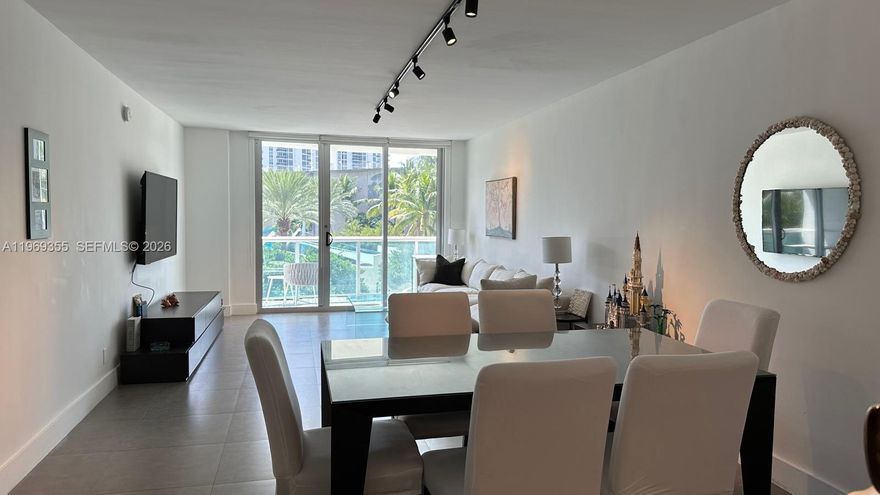 Beautifully updated 1-bedroom, 1.5-bath residence in the heart of Sunny Isles Beach. This spacious 1,005 sq ft unit features a modern open kitchen with stainless steel appliances, sleek cabinetry, and quartz countertops. Large-format tile flooring throughout, updated bathrooms, generous walk-in closet, and a private balcony with tranquil park and city views. Ideal for full-time living or investment.