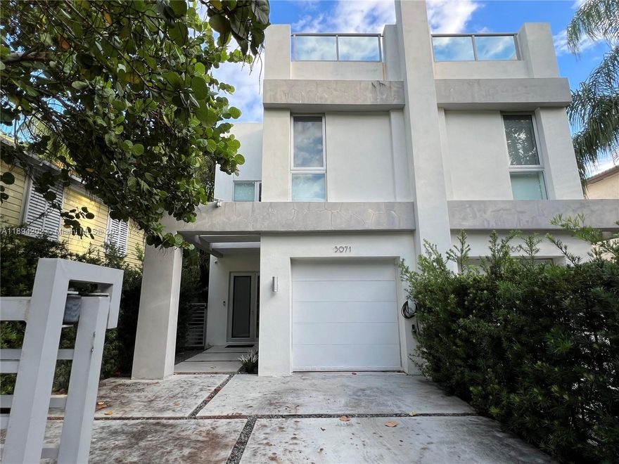 Luxurious Contemporary Living Coconut Grove Townhouse! High-grade designer finishes and open floor plan. This 3 bedroom, 3 bathrooms, 1 car garage and 2 guest spaces has ultra-modern fixtures and floor-to-ceiling impact glass. Beautiful terrace area with pool and lots of space. Private rooftop terrace with a high-end barbecue, wet bar, views of lush landscaping and tropical neighborhood. 2,300 Sq Ft plus Pool Area Terrace and a 950 Sq Ft Rooftop Terrace!