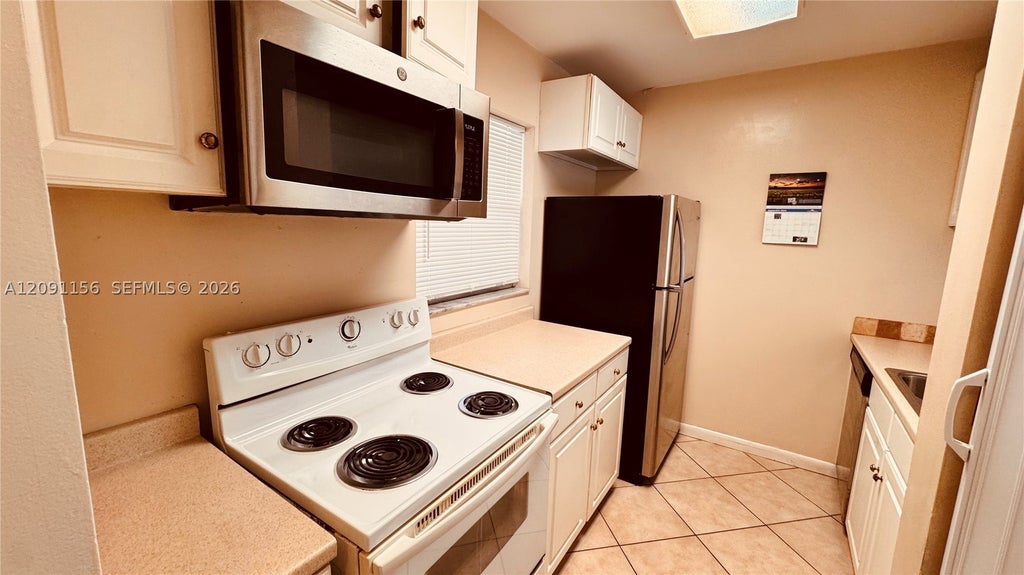 Photo of 3214 NW 103rd Ter #108-B, Coral Springs, FL 33065 (MLS # A12091156)