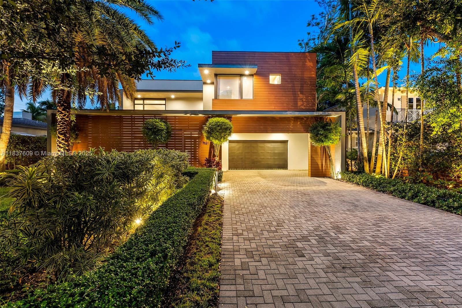 Discover the pinnacle of luxury in this extraordinary smart home nestled in one of S. Miami’s most coveted enclaves. Designed for comfort and privacy it features an automation system managing lighting, climate, shades, and premium surround sound in living areas. The open-concept layout includes a gas fireplace, built-in bar, and an elegant Brazilian wood-accented wall. The gourmet Mia Cucina kitchen boasts Wolf/SubZero appliances, gas range, and walk-in pantry. Upstairs offers a home theatre w/ 110” screen, retro kitchenette, and game room. The lux primary suite includes motorized drapes, and a spa-style bath w/ oversized shower, and huge custom closet. Entertain year round in the outdoor retreat that includes saline pool, turf yard, and shower. +2-car garage w/AC, and EV charger. Turnkey!