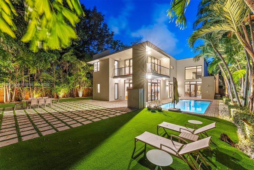 Discover the pinnacle of luxury in this extraordinary smart home nestled in one of S. Miami’s most coveted enclaves. Designed for comfort and privacy it features an automation system managing lighting, climate, shades, and premium surround sound in living areas. The open-concept layout includes a gas fireplace, built-in bar, and an elegant Brazilian wood-accented wall. The gourmet Mia Cucina kitchen boasts Wolf/SubZero appliances, gas range, and walk-in pantry. Upstairs offers a home theatre w/ 110” screen, retro kitchenette, and game room. The lux primary suite includes motorized drapes, and a spa-style bath w/ oversized shower, and huge custom closet. Entertain year round in the outdoor retreat that includes a pool, turf yard, and shower. +2-car garage w/AC, and EV charger. Turnkey!