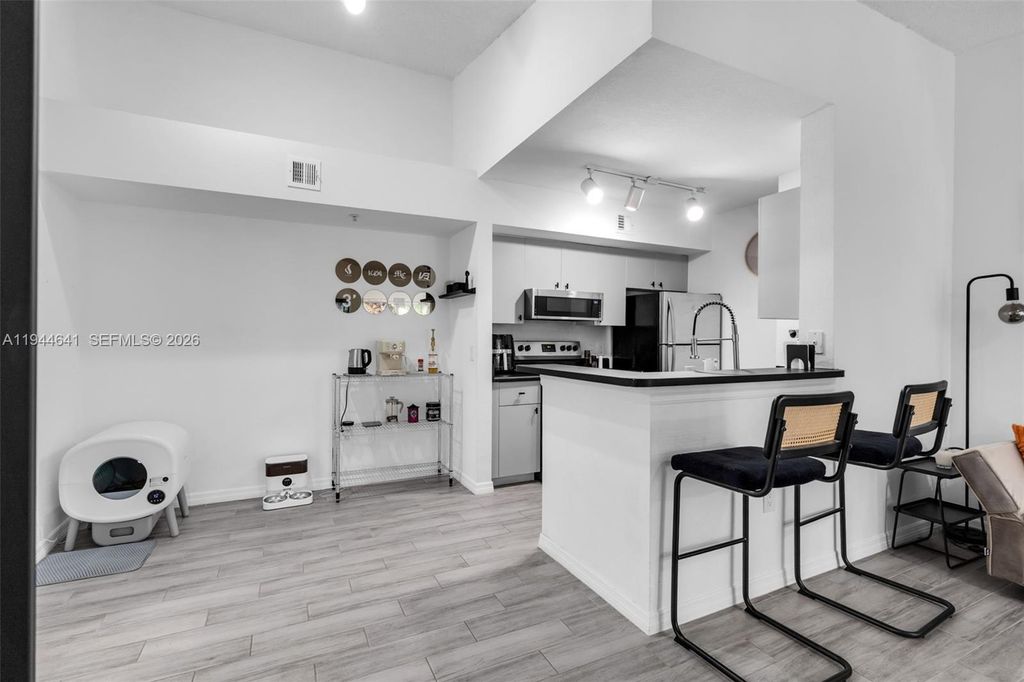 Photo of 2457 Centergate Dr #306, Miramar, FL 33025 (MLS # A11944641)